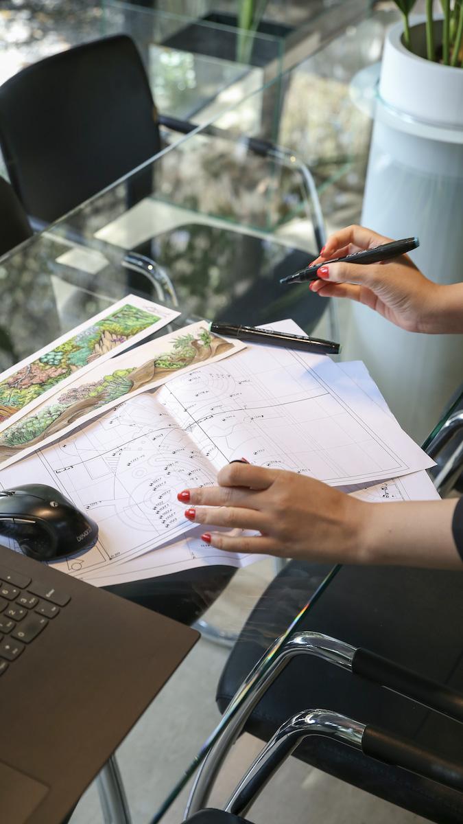 image of a cafe with plants behind it