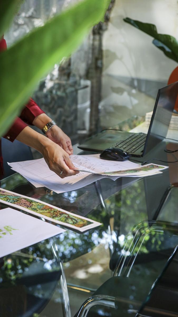 image of a cafe with plants behind it